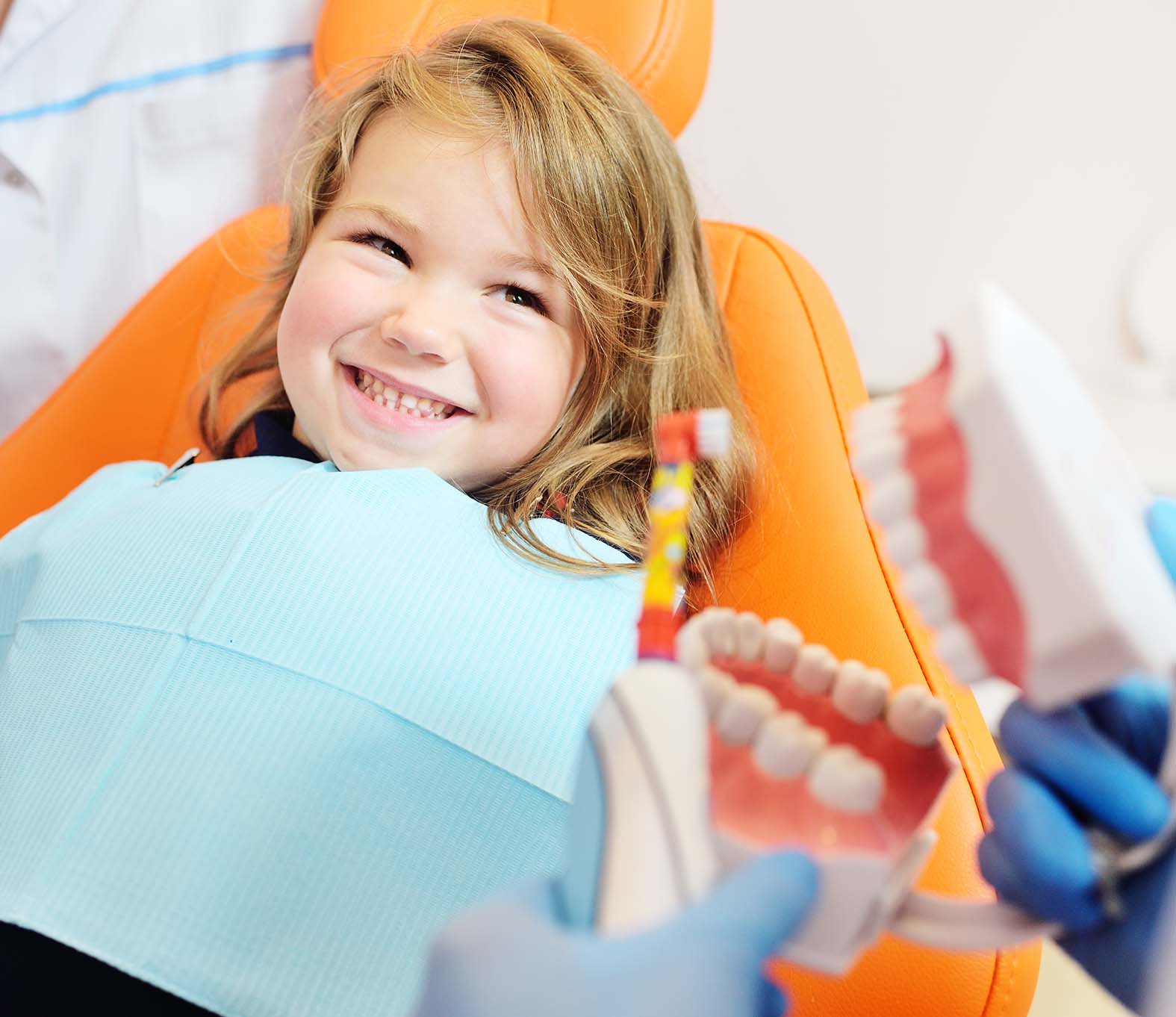 Smiling child receiving gentle care from a pediatric dentist in South Miami.